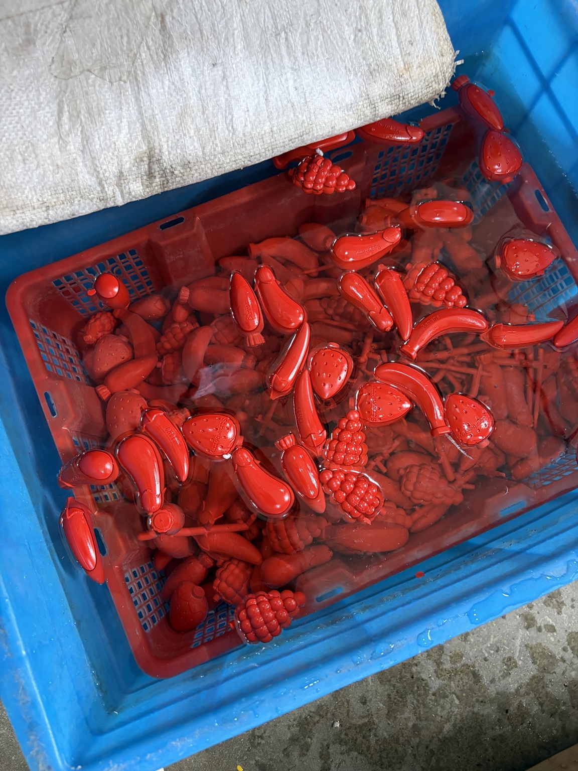 Freshly molded shaped crayons in factory production